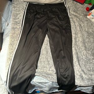 Mostly black has white stripes Adidas size 2 XL fits very loose